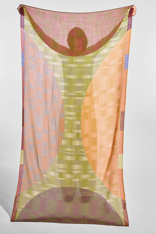 A sheer rectangular scarf or fabric panel with an abstract geometric print, hanging against a plain light gray studio background. The design features a central vertical striped motif in muted yellow-green tones, flanked by peach, orange, pink, and lavender curved and block patterns.