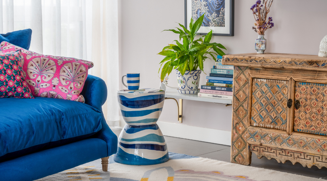 Living room of interior designer, Isabelle Ada, featuring a carved wooden sideboard from Rouge