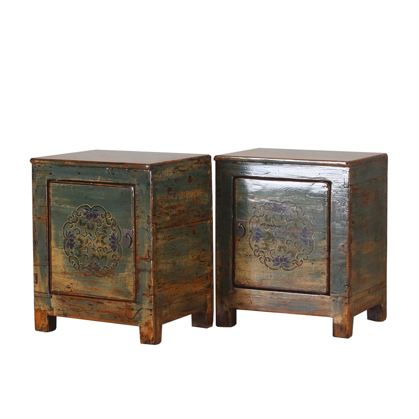 Pair of vintage wooden cabinets with decorative carvings on a white background