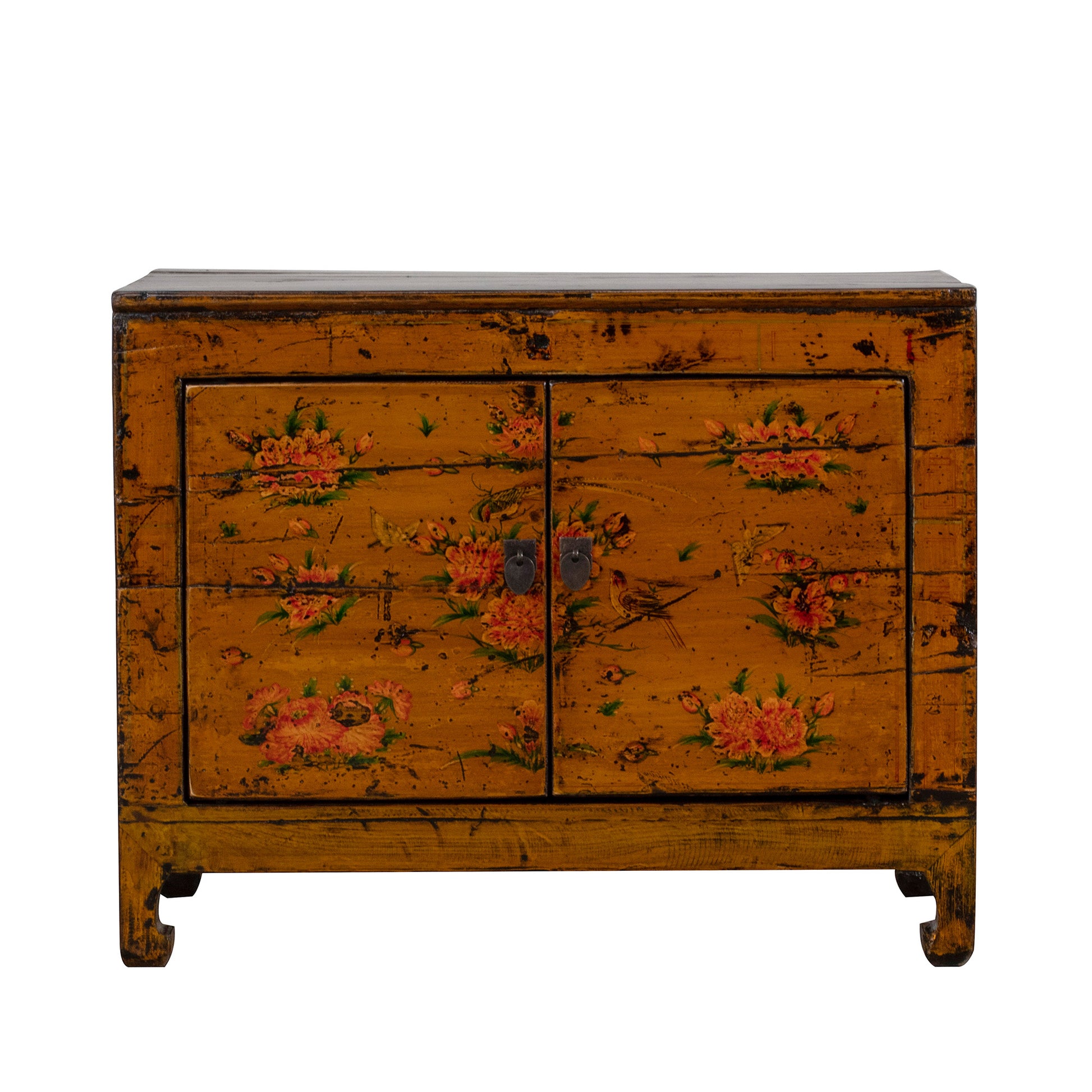 Vintage orange wooden cabinet with floral patterns on a white background