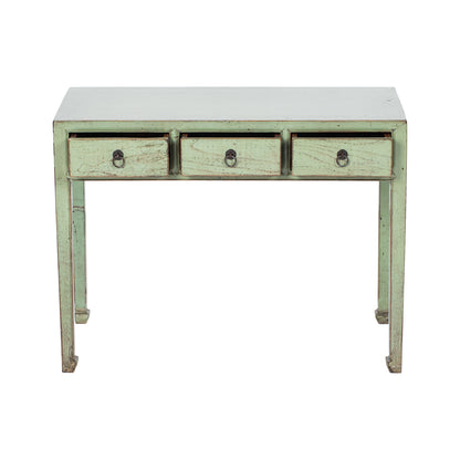 Green wooden desk with three drawers on a white background