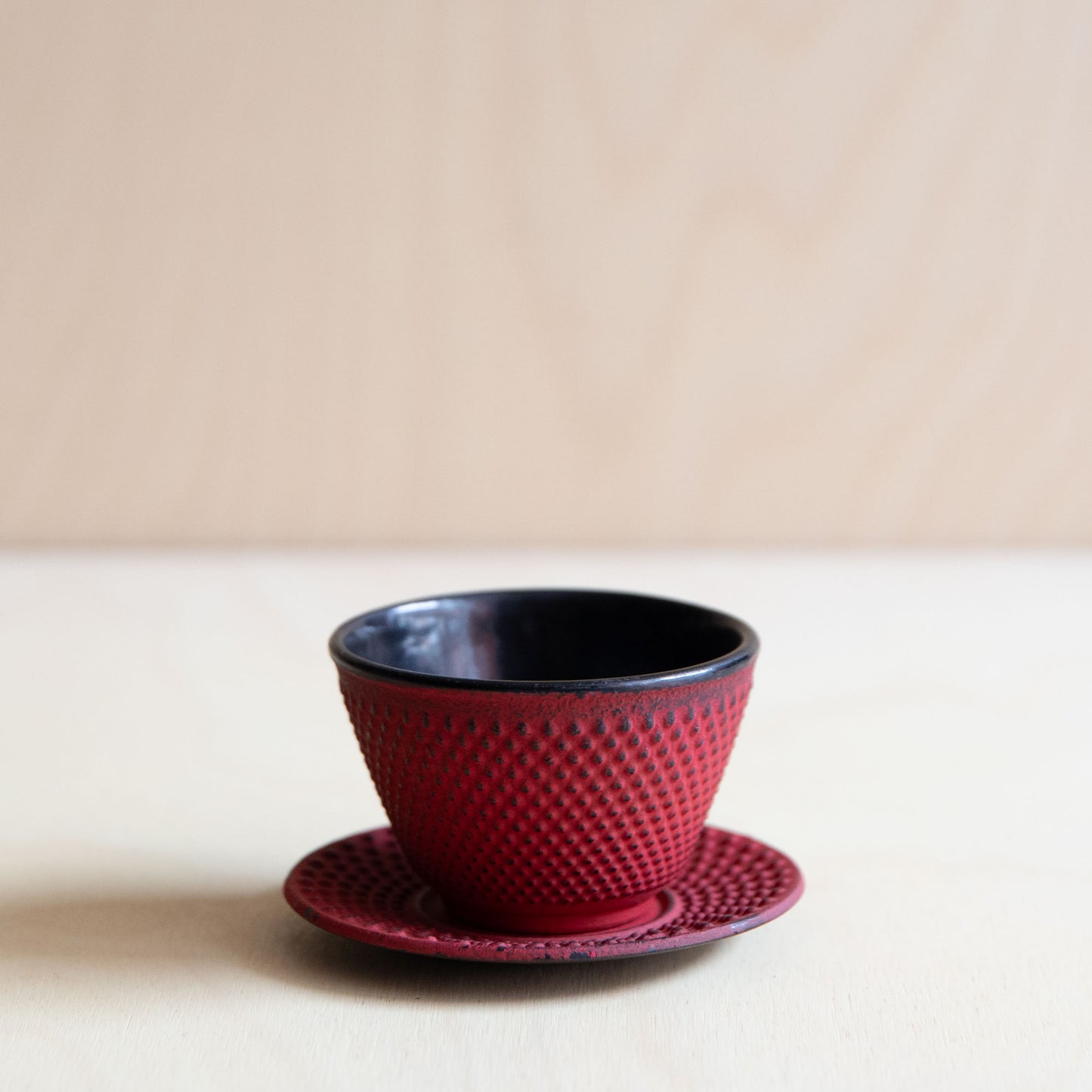 Red Cast Iron teacup and saucer