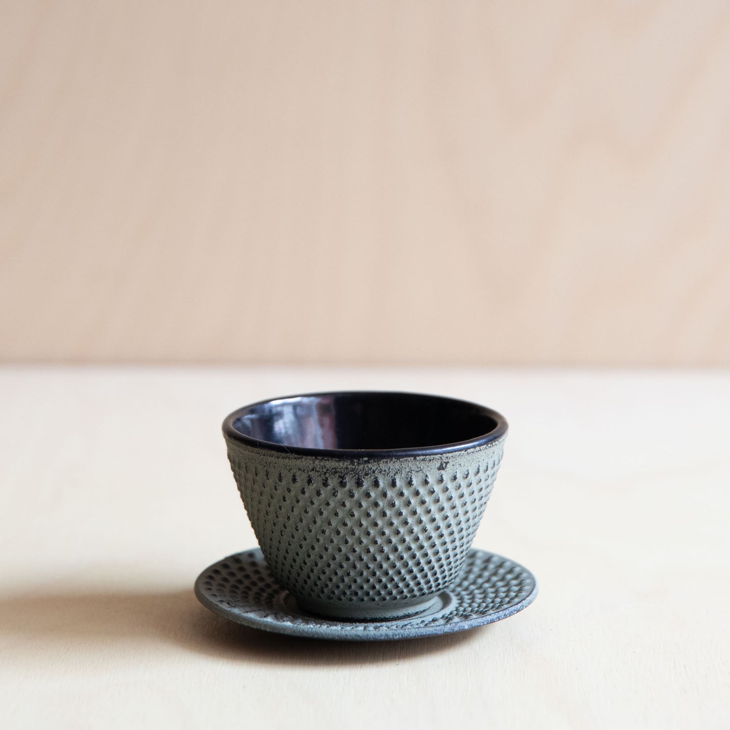 Green Grey Cast Iron teacup and saucer