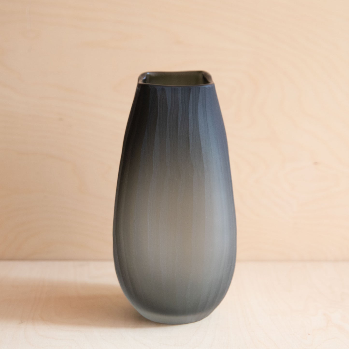 Gradient vase on a beige background