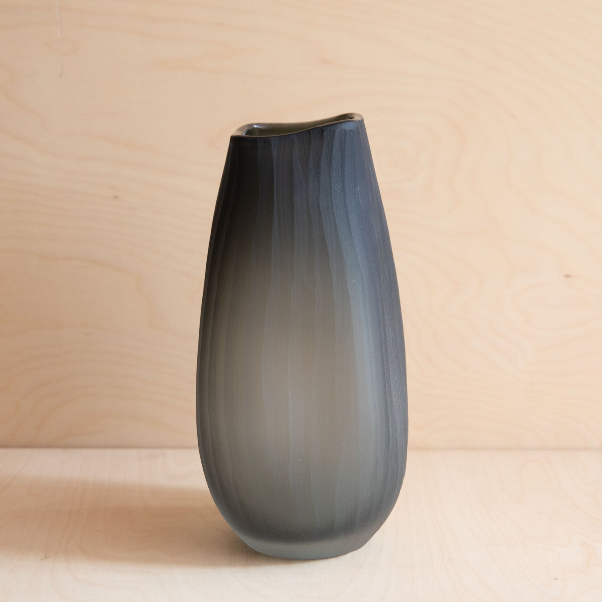 Gray vase on a wooden surface