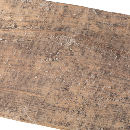 Close-up of a vintage Chinese wooden bench with visible grain and texture